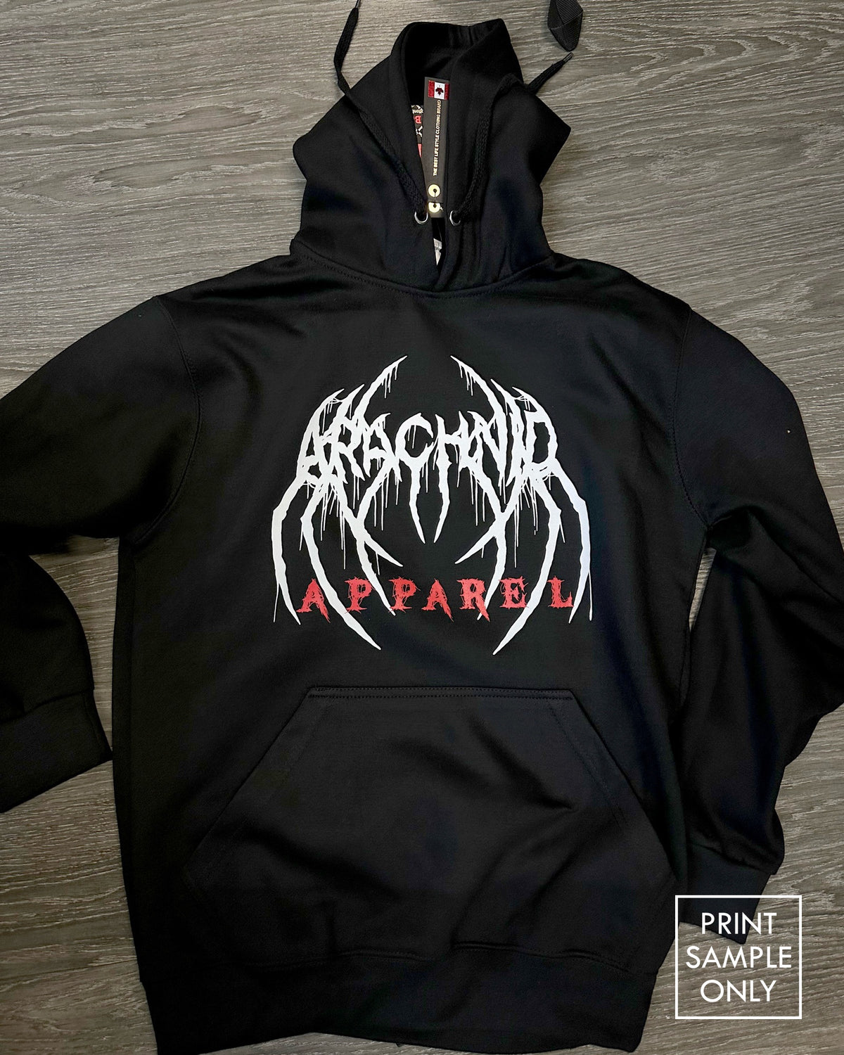 Sample print on a black hoodie: spider logo (print sample only)