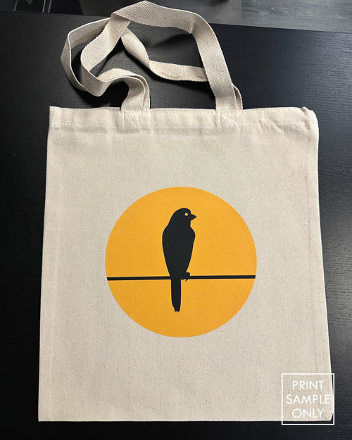 Sample print on a natural canvas tote bag: bird on a wire (print sample only)