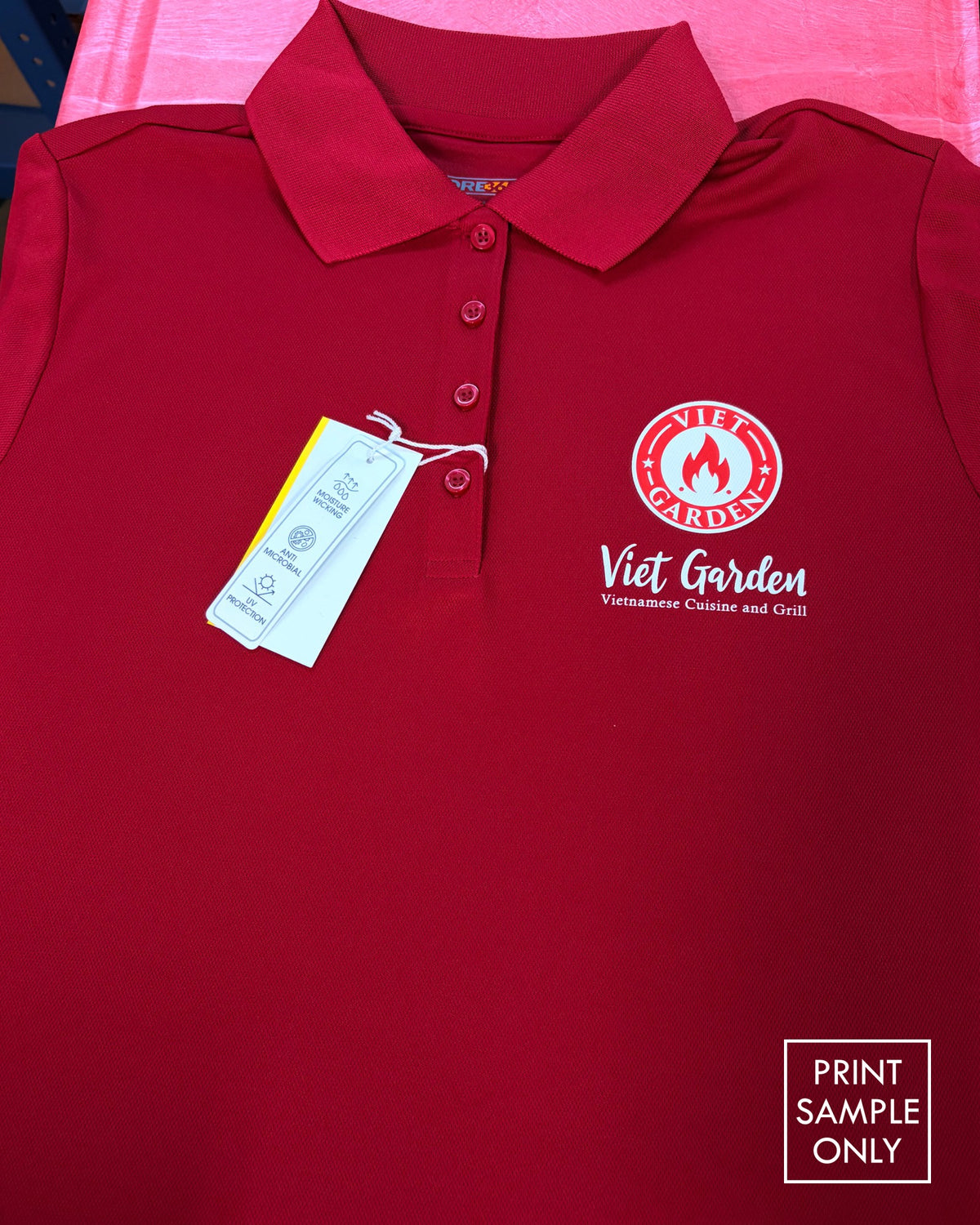 Sample left chest logo print on a red polo shirt (print sample only)