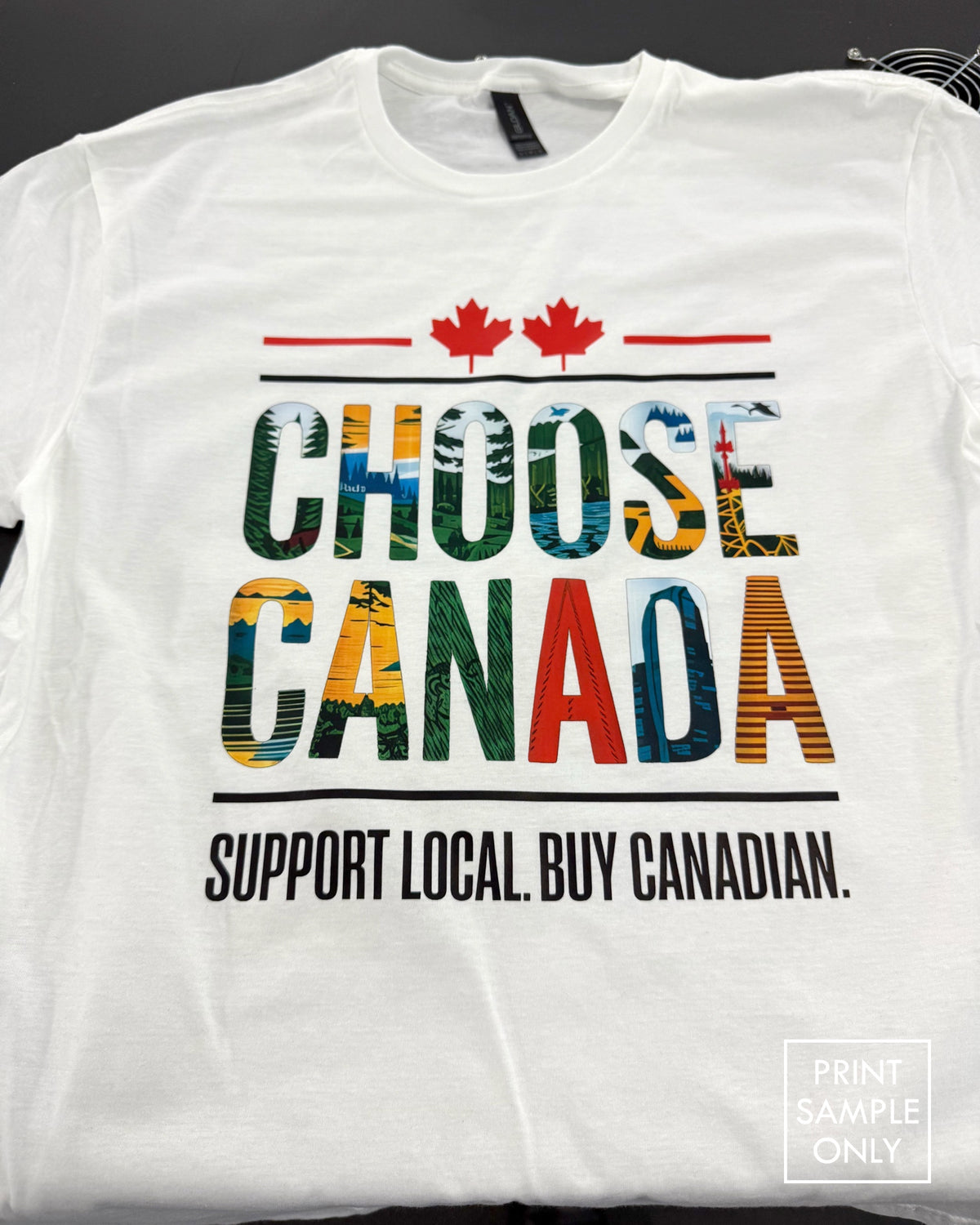 Sample print on a white t-shirt: Choose Canada, Support Local. Buy Canadian. (print sample only)