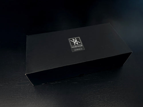 Custom Engraved Wine Glass – 11oz Tulip Design gift box with logo on black surface, elegant packaging for wine glass set.